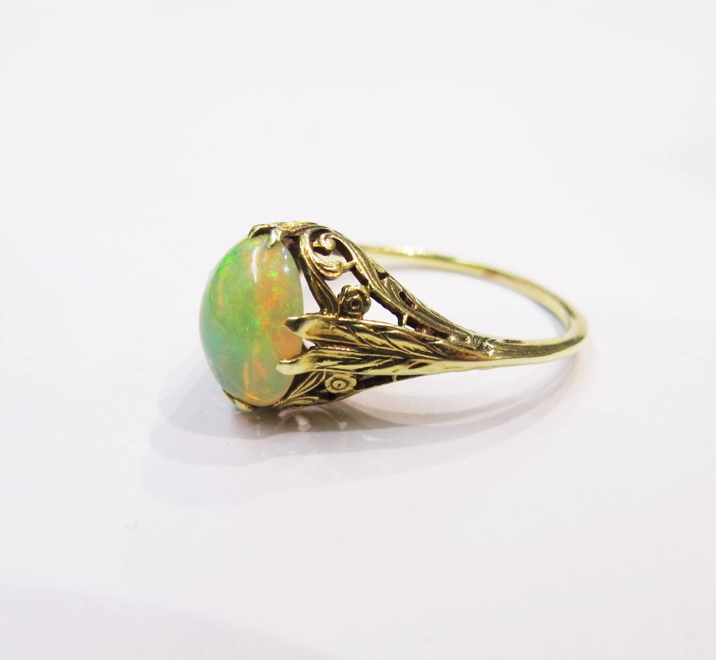 Opal cabochon set in 14k yellow gold Art Nouveau setting. c. 1910. Currently available at Gray & Davis.