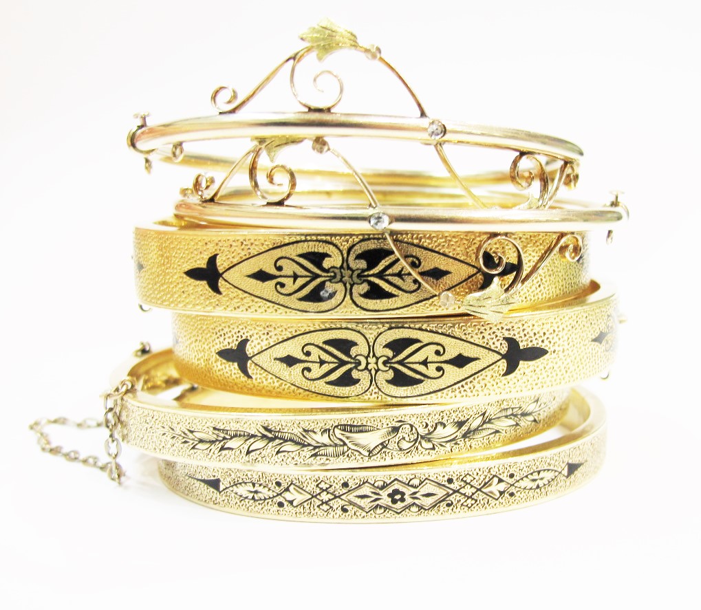 Three sets of nineteenth-century bangles in 14k yellow gold, all available at Gray & Davis.