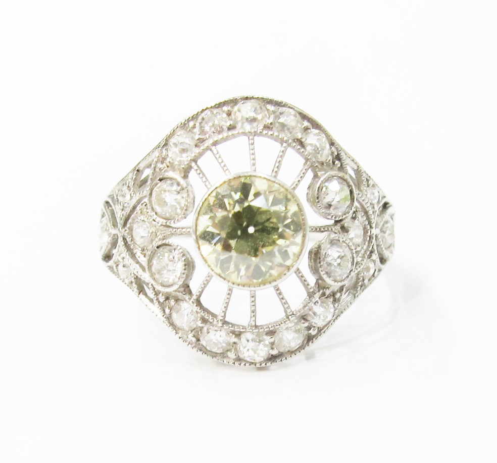 Edwardian ring with platinum filigree and white & yellow diamonds.