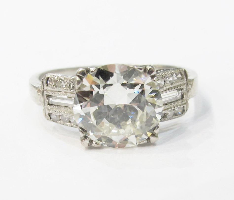 Art Deco engagement ring with baguettes, single cuts and 2.15 carat old European cut center. 
