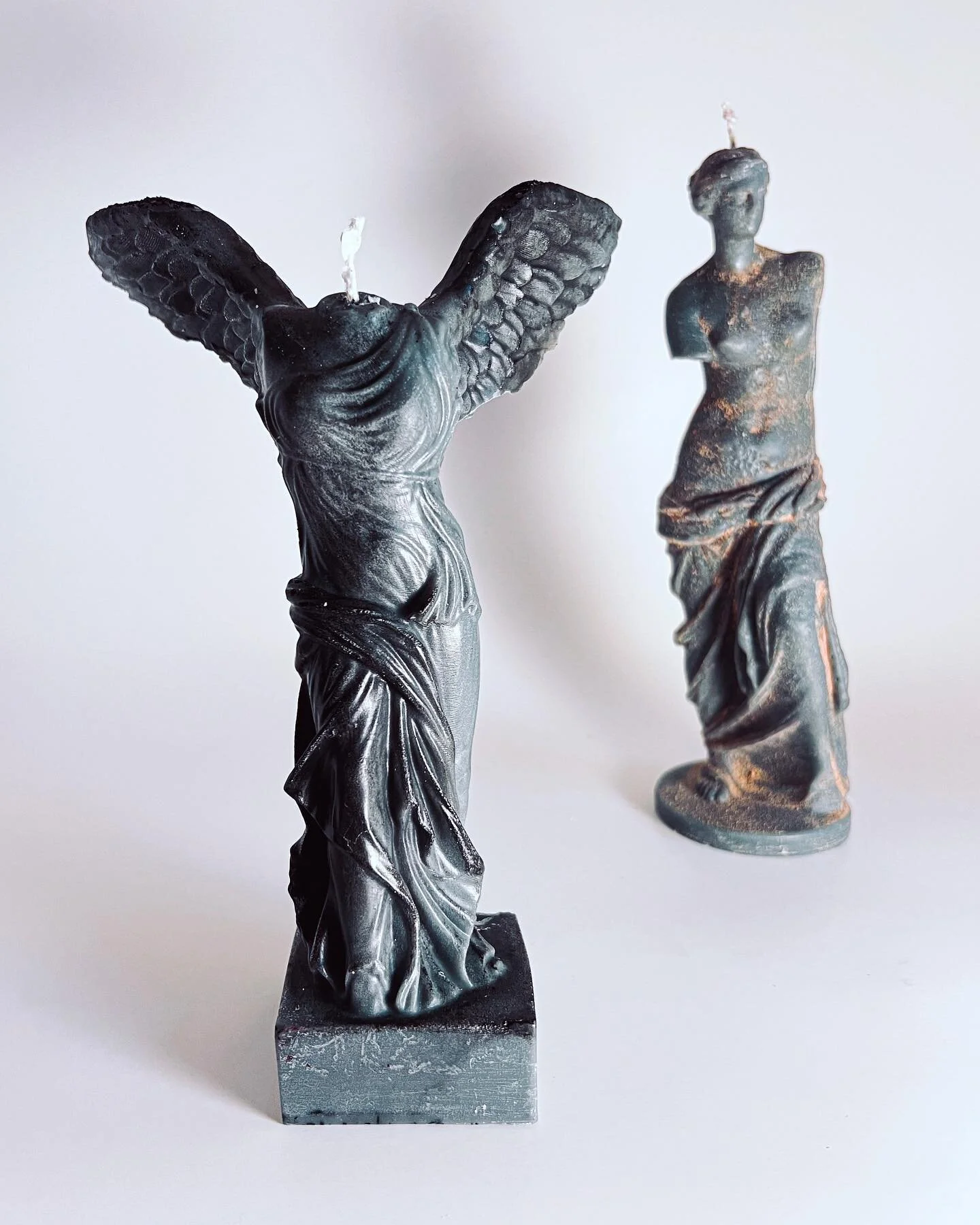 Each candle sculpture is handmade. These prototypes are part of my creative process in deciding on color schemes and fragrances. I wanted the figures to look like they where found  while on excavation so I used things like wood and ash to paint the f