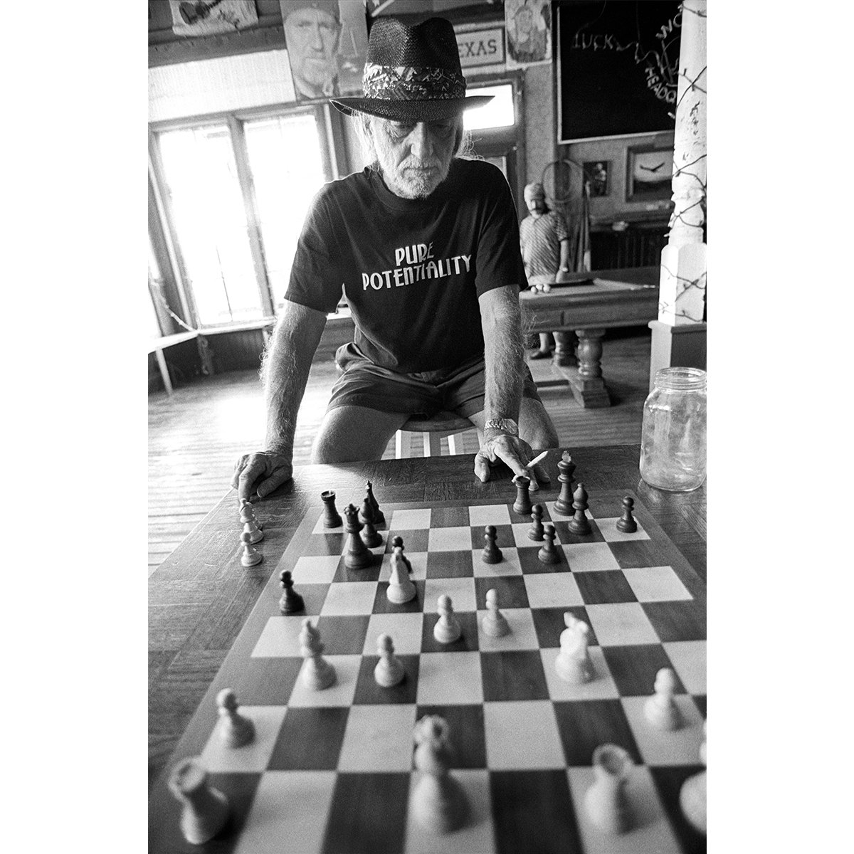 Willie playing chess by Scott Newton