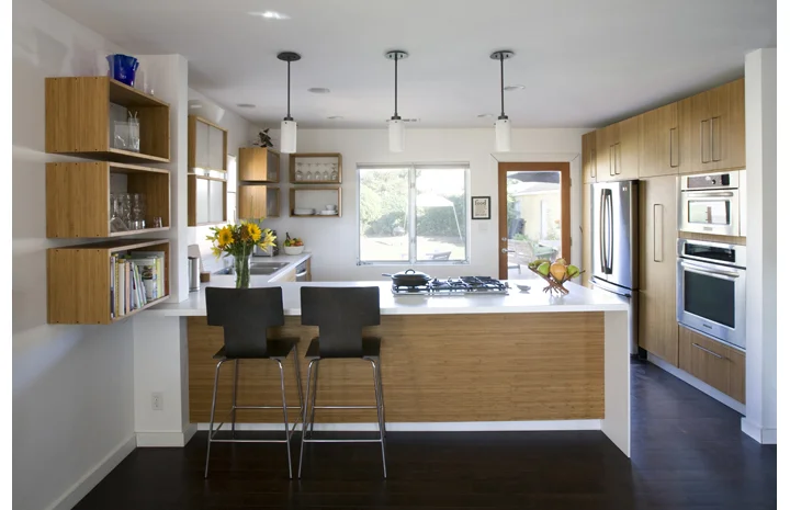A view from the living room through the kitchen and into the back yard.