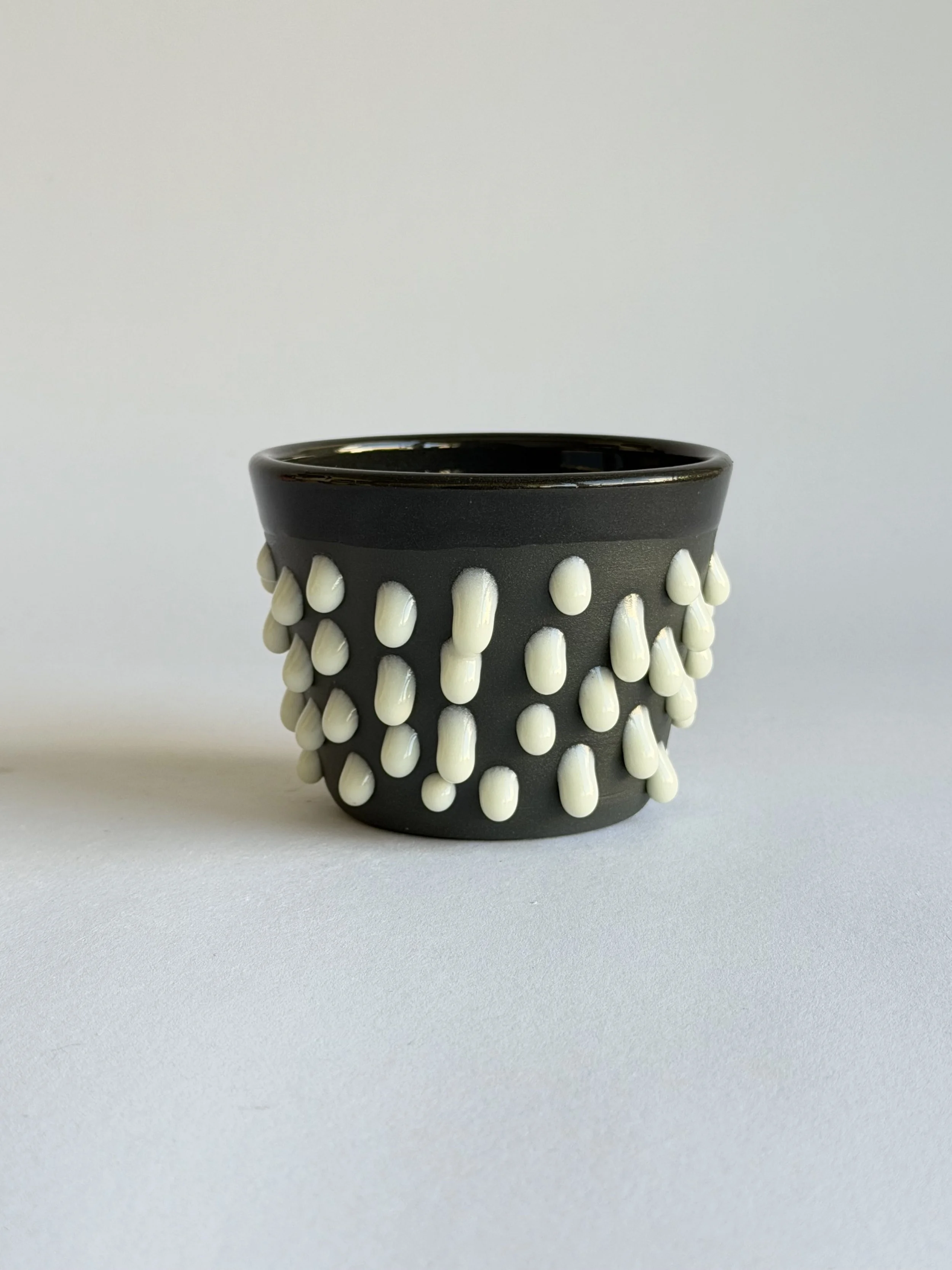 latte cup in black and off white