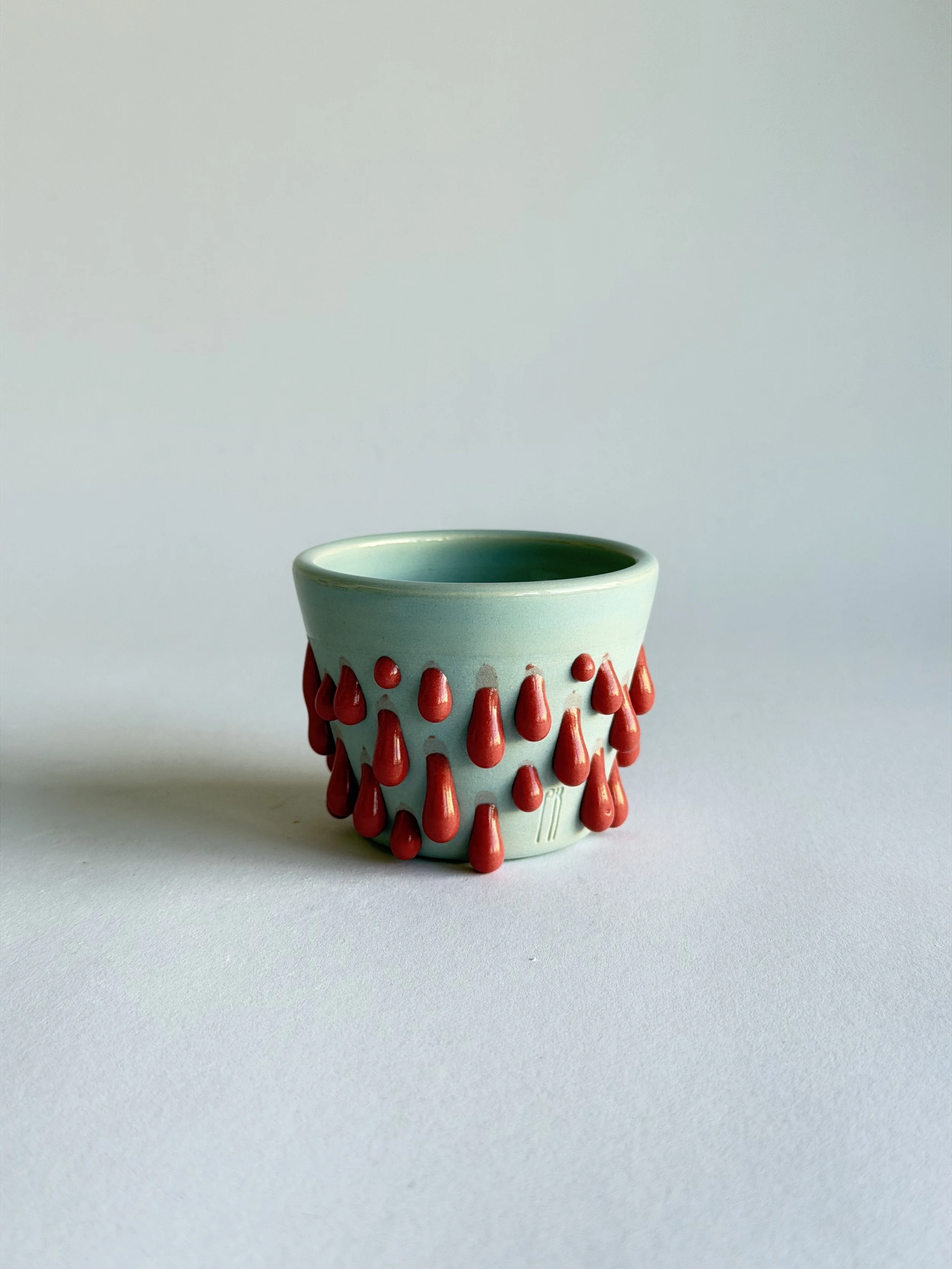 espresso cup in light blue and red