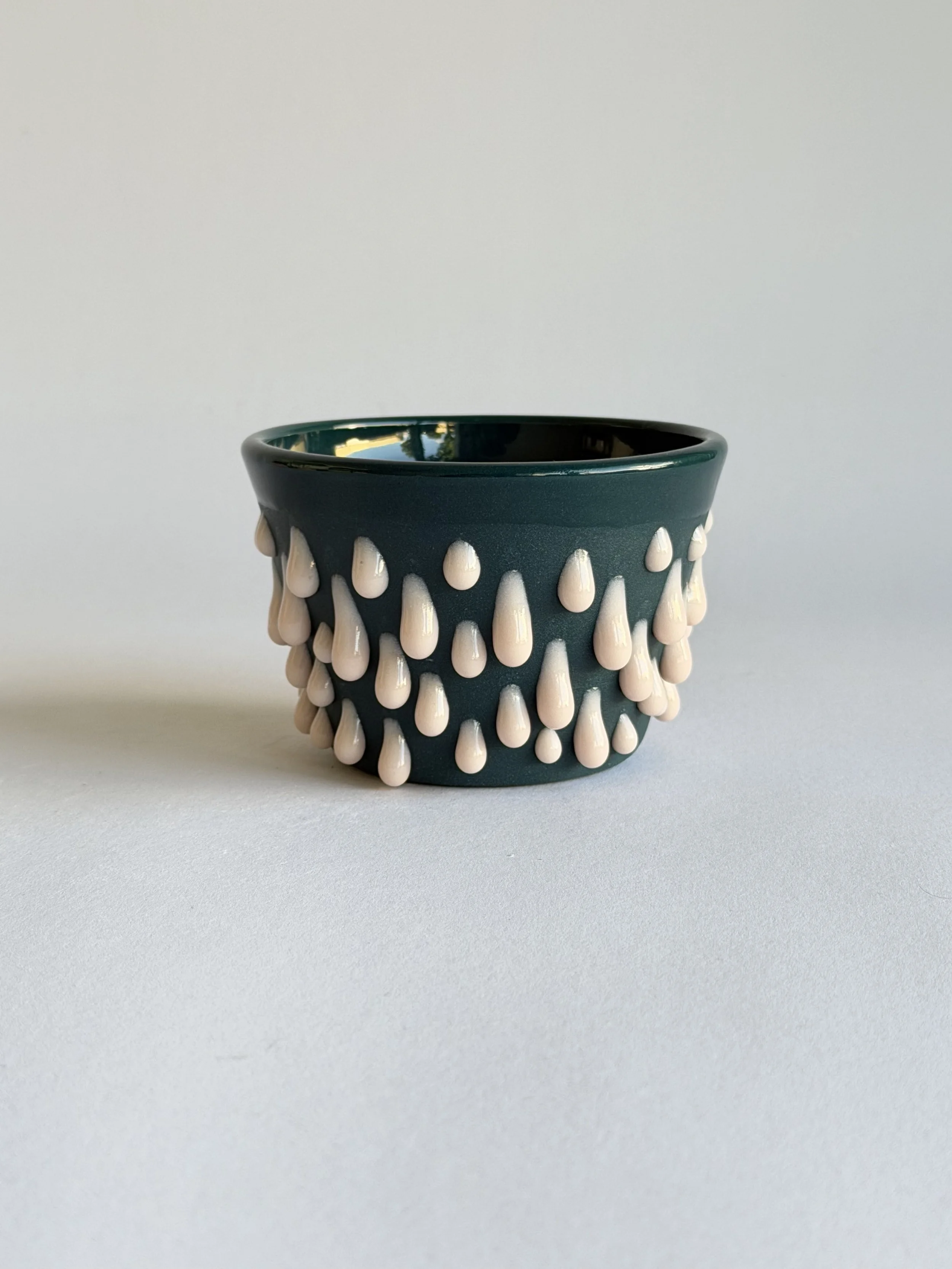 latte cup in dark teal green and pink