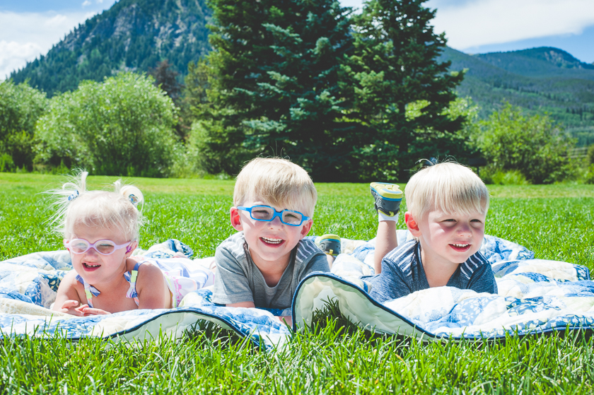 Three grandchildren in family photos. Three siblings together in a family photo. Young children in family photos. Summer family photos in the mountains.