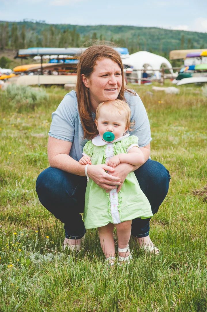 Mom and young daughter are both pensive in this photo, taken between shots at their larger destination family photo shoot.