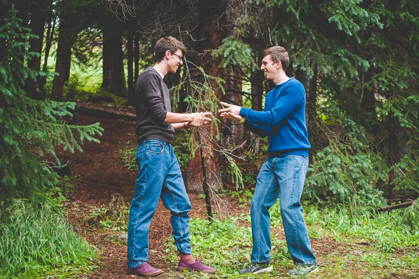 Brothers face off in a game of rock, paper, scissors during their family photo shoot at Copper Mountain Resort, near Breckenridge, Colorado.