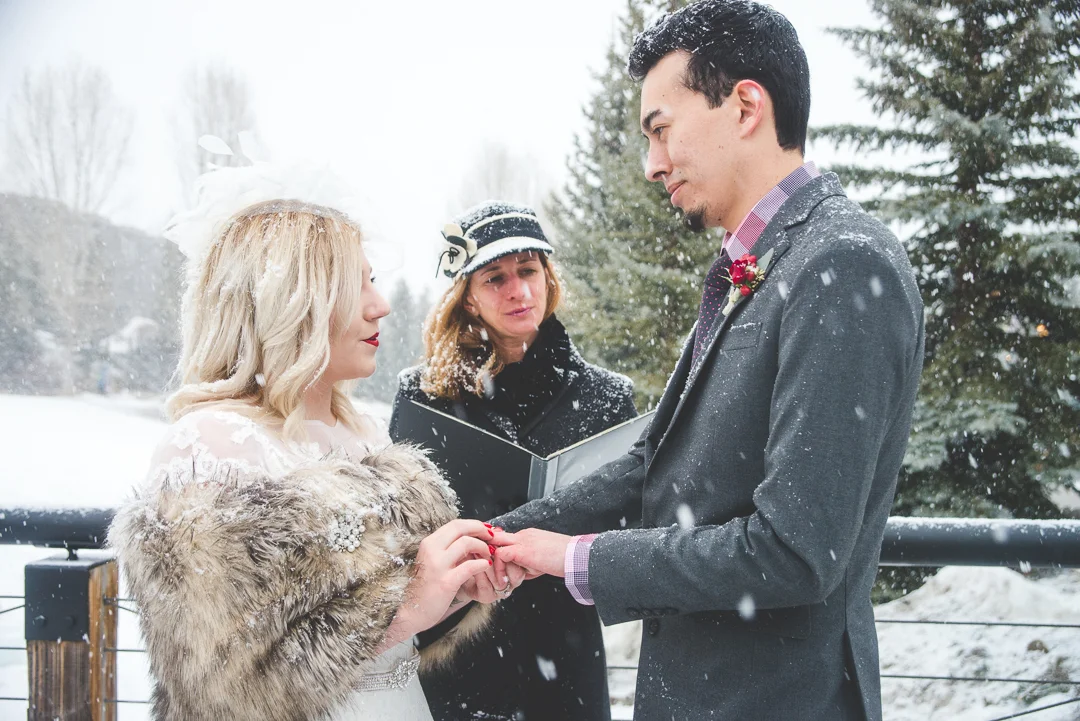 A snowy mountain elopement in the middle of winter, in the heart of Breckenridge, Colorado | Red wedding accents that pop in the white snow | Keeping Composure Photography