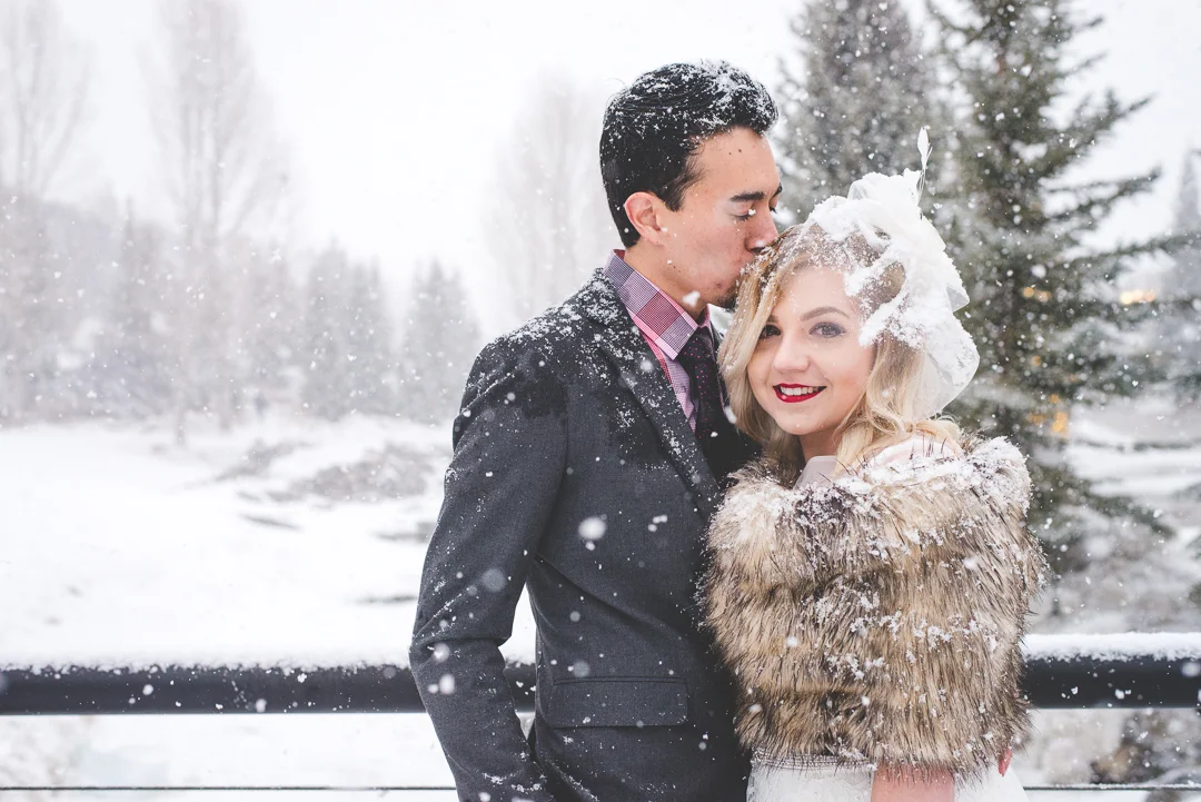 This Colorado bride and groom braved the pounding snow for their winter elopement in Breckenridge - how far would you go for the perfect wedding photos? Worth it. | Keeping Composure Photography