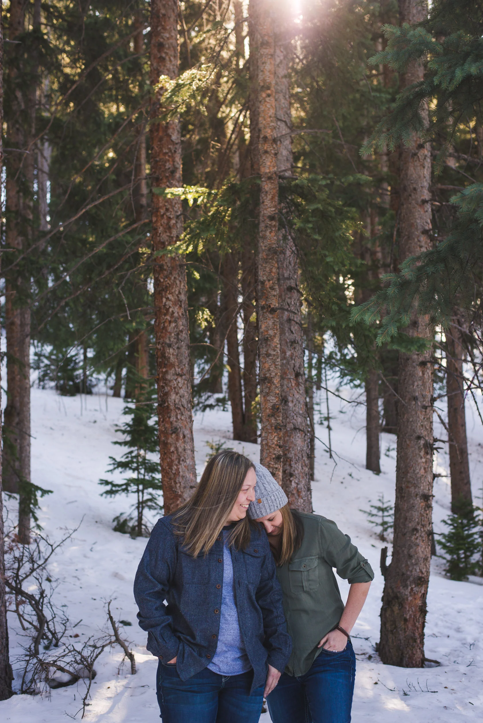 two women celebrate their upcoming winter wedding in Breckenridge, Colorado with a casual engagement photo session | Keeping Composure Photography