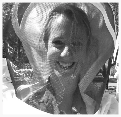 Niki wearing a bee suit, not her usual attire for taking photos of lizards