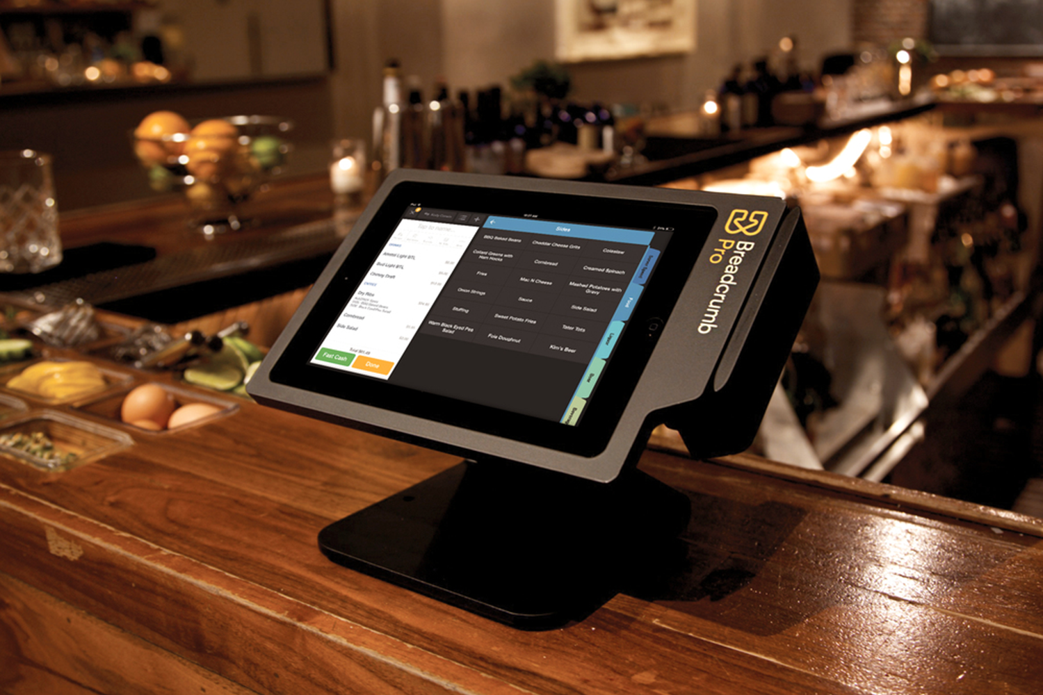 Breadcrumb ipad Point of Sale device on the counter at a restaurant. Screen showing inventory of items.