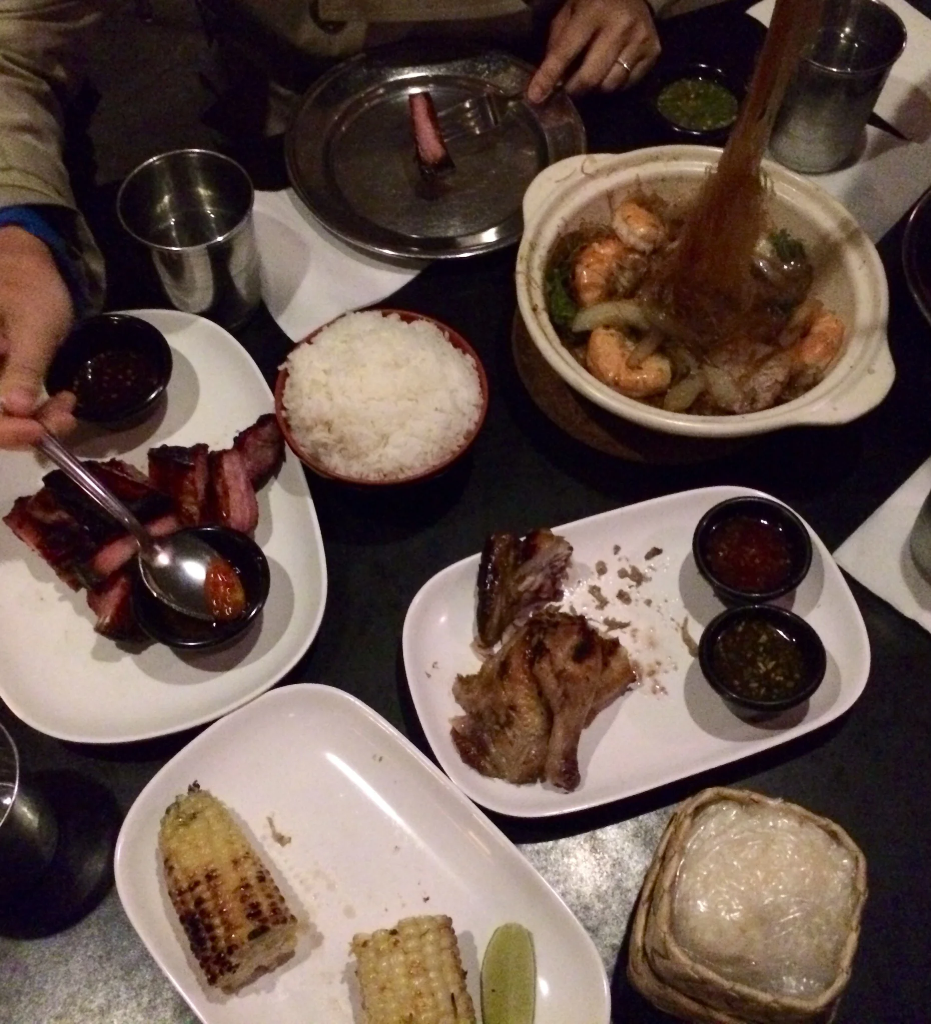 SII KHRONG MUU YANNG - baby back ribs. KAI YAAGE - charcoal roasted natural game hen CORN ON THE COBB KUNG OP WUN SEN - prawns and rice noodles cooked in a clay pot. 