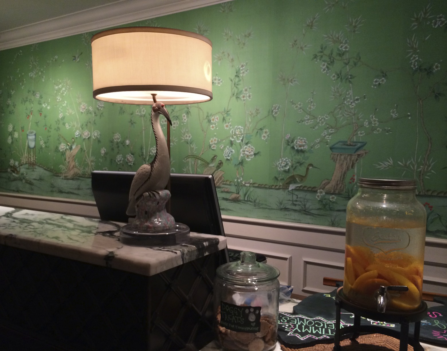 Love the wallpaper behind the check-in desk. 