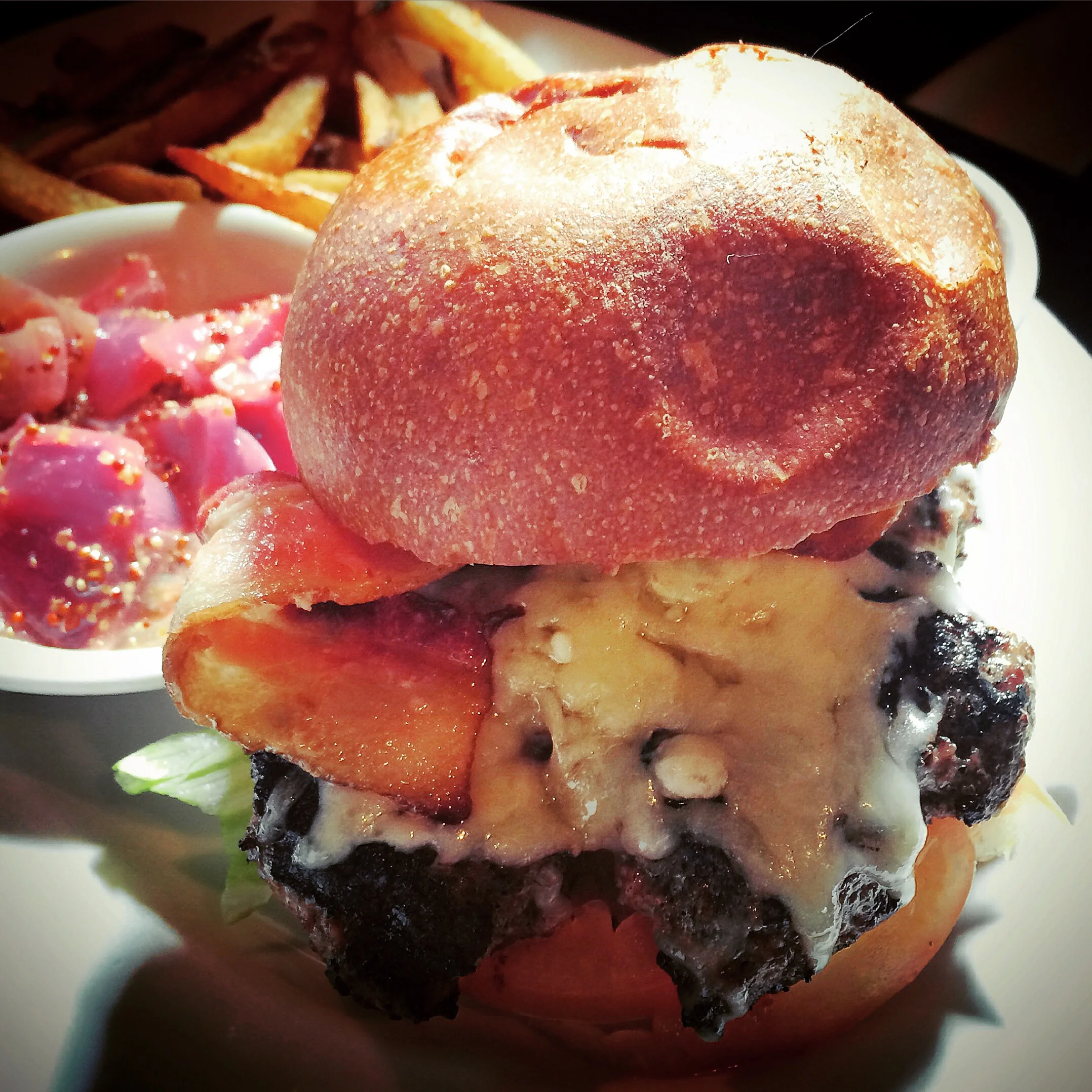 The french burger with Caramelized onions, Bacon, Mustard Sauce, White Cheddar