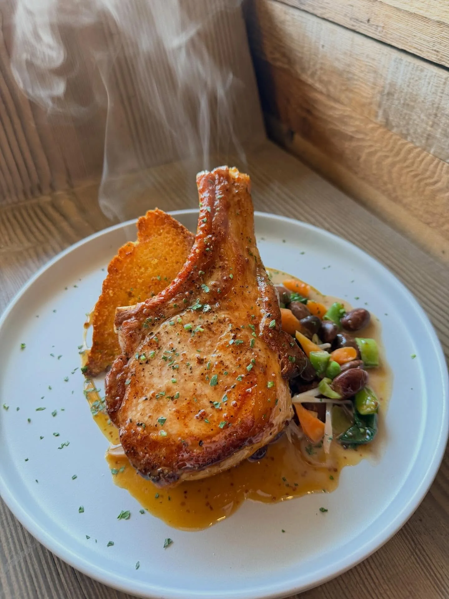 Fresh out of the oven Niman Ranch Iberian Pork Chop

Buttermilk &lsquo;Skillet Cornbread, Winter Succotash, Cr&egrave;me Fra&icirc;che-Dijon Reduction &amp; Mostarda Gastrique