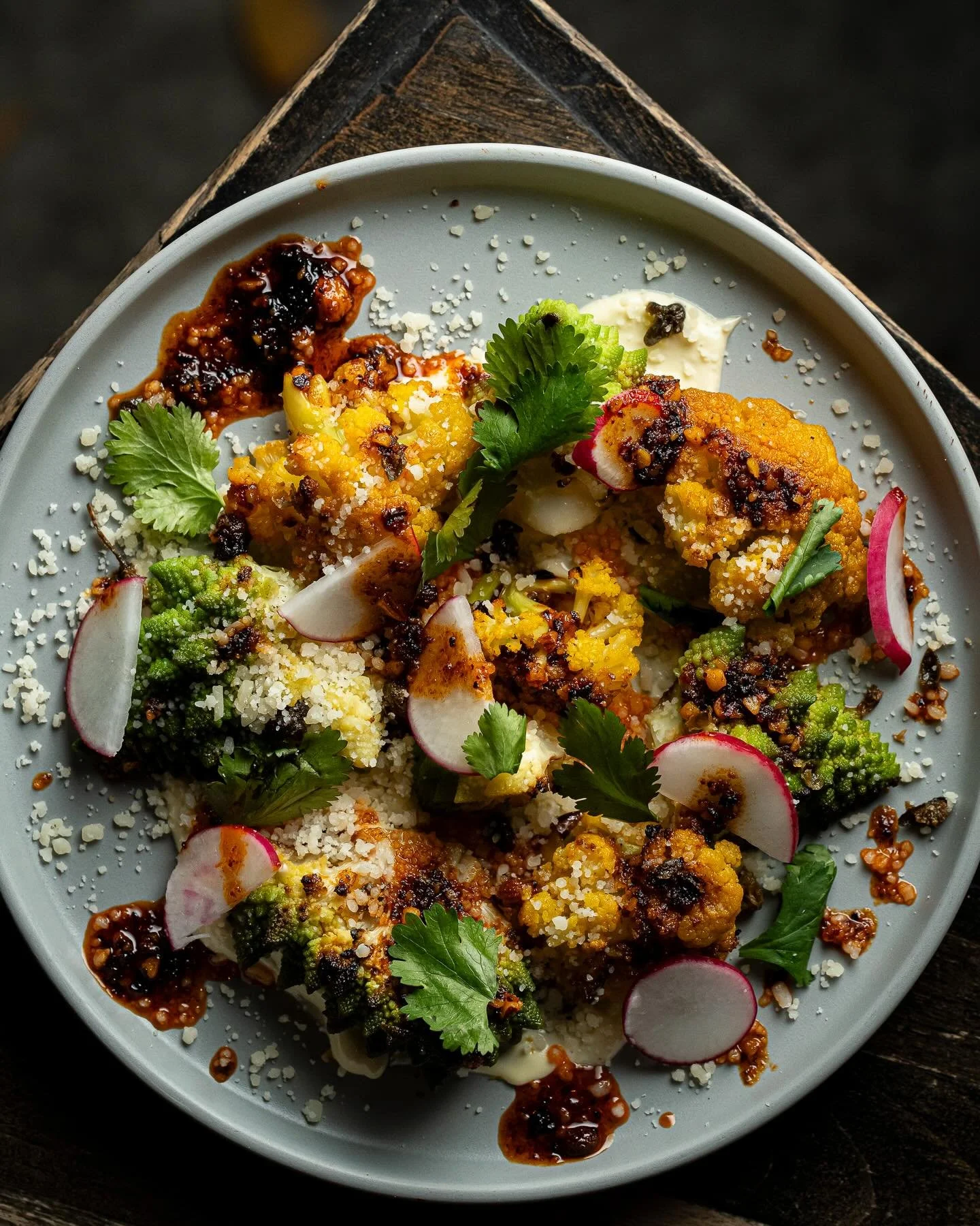 Try our 2 Peas Roasted Cauliflower! 😋

Caesar Dressing, Almond-Guajillo Salsa Macha, Fried Capers, Radish, Grana Padano &amp; Cilantro