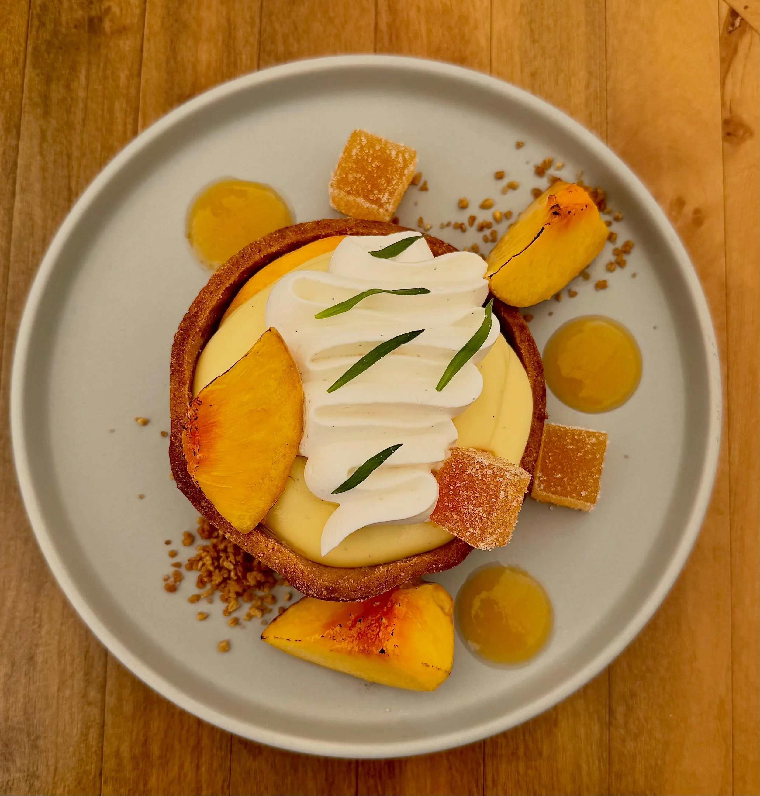 New Dessert! Fresh Peach Tart

Vanilla Cremeux, Pate Sucre, Chantilly Whip, Steel Cut Oat Crumble, Peach Compote