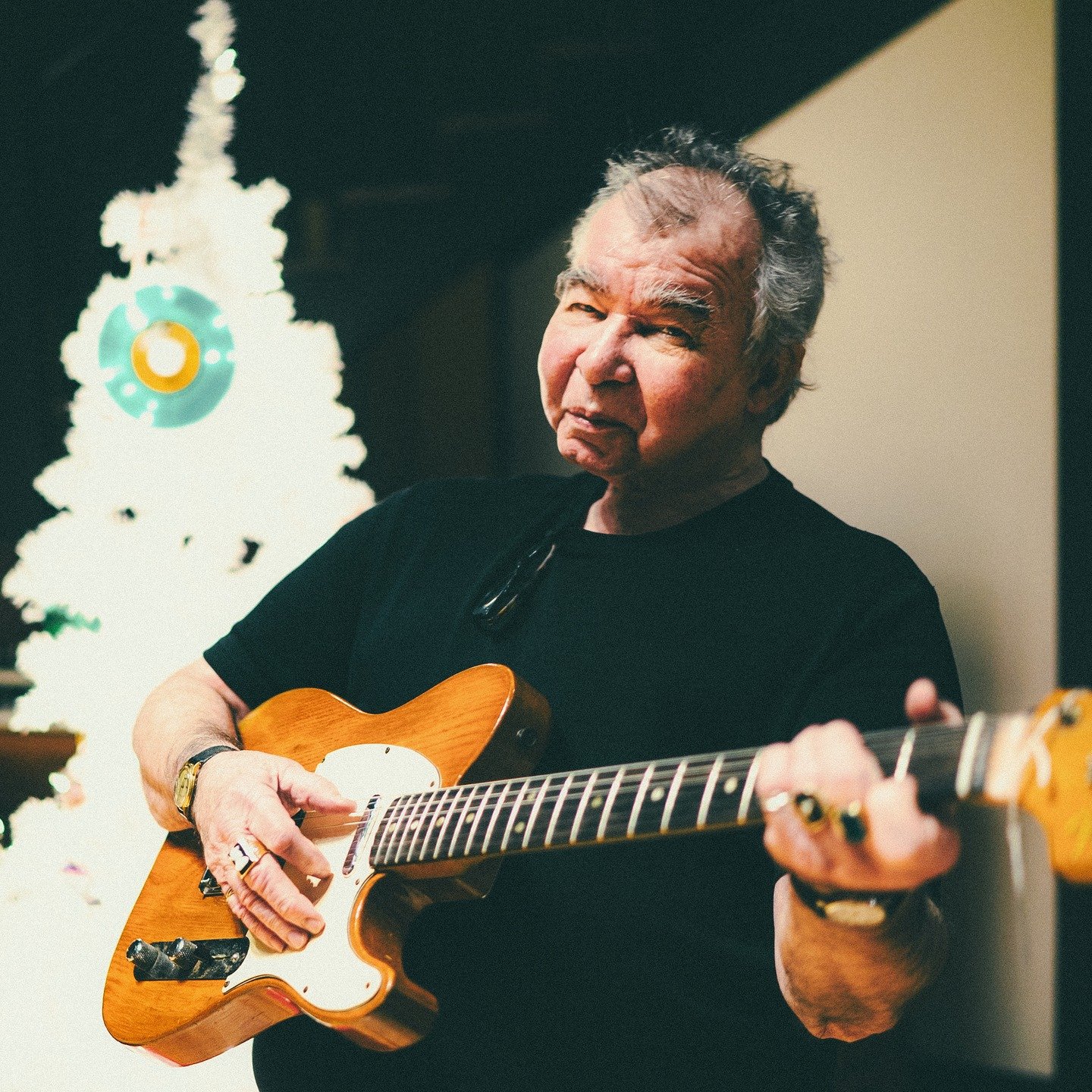 I took this photo of John Prine in the summer, but he brought Christmas with him into the studio anyway. He loved it so much he kept trees up all year long. 

If you&rsquo;re scrambling for a last-minute gift like I usually am, go grab a &ldquo;Chris