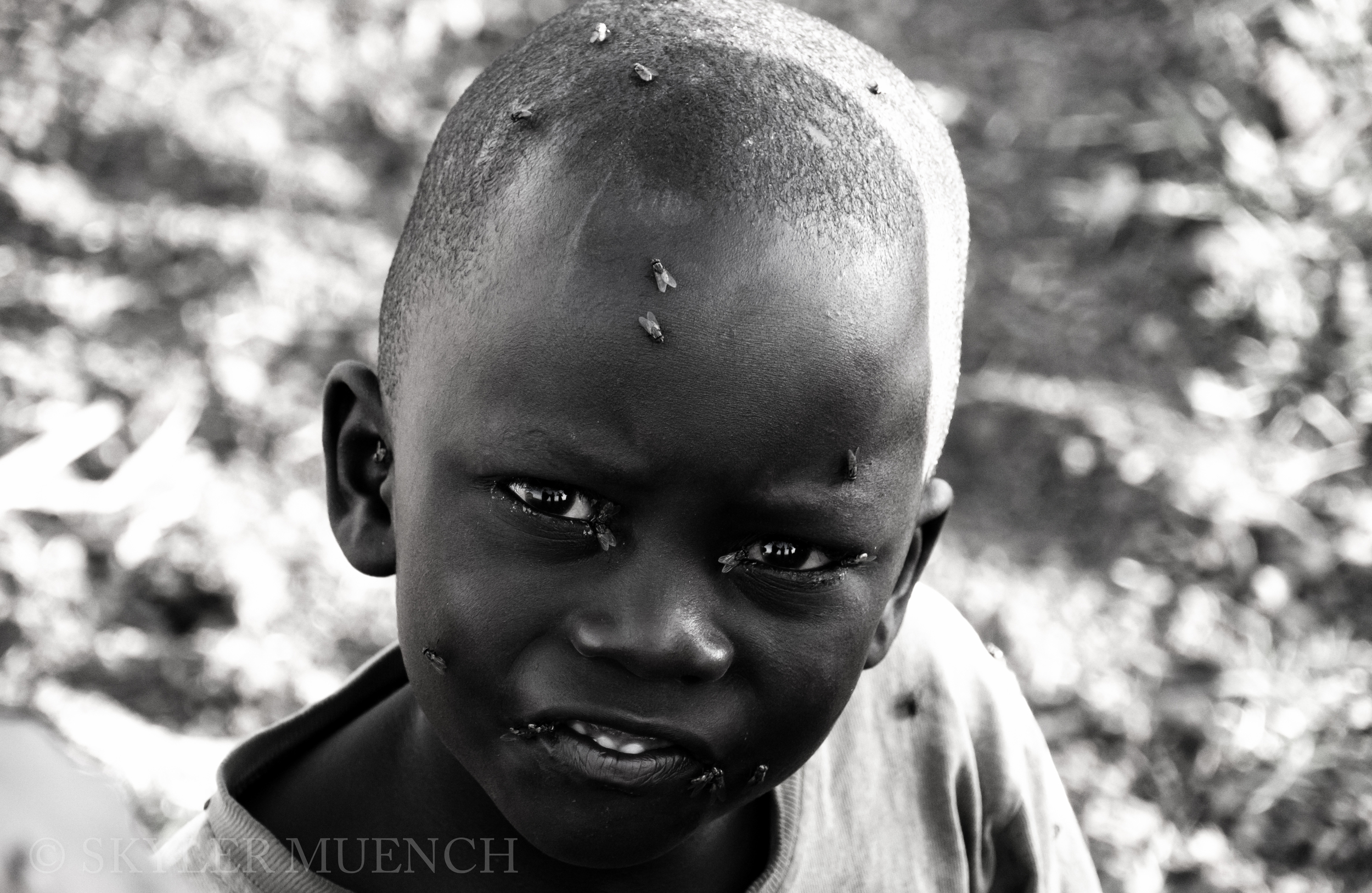 b&w boy with flies.jpg