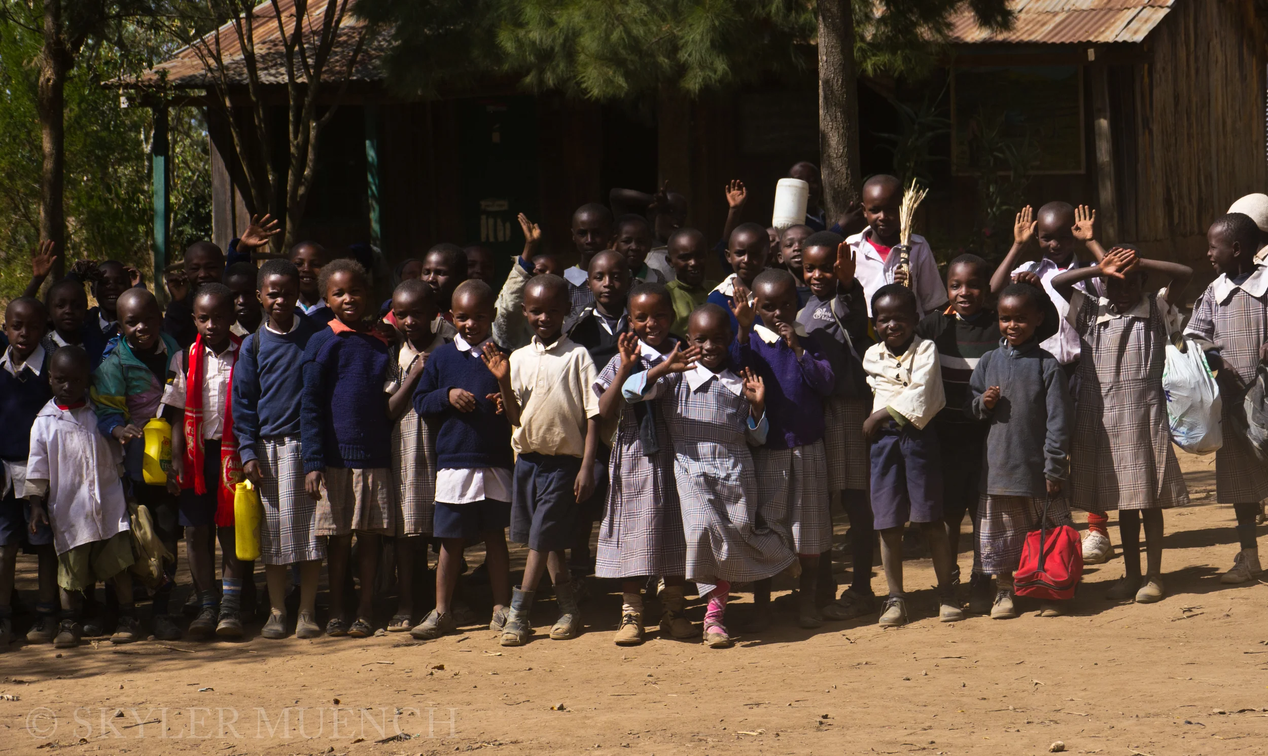 school kids waving.jpg