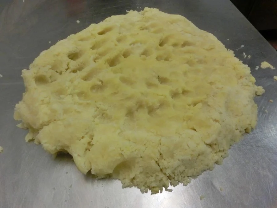 When potatoes are riced, pile on work area. 