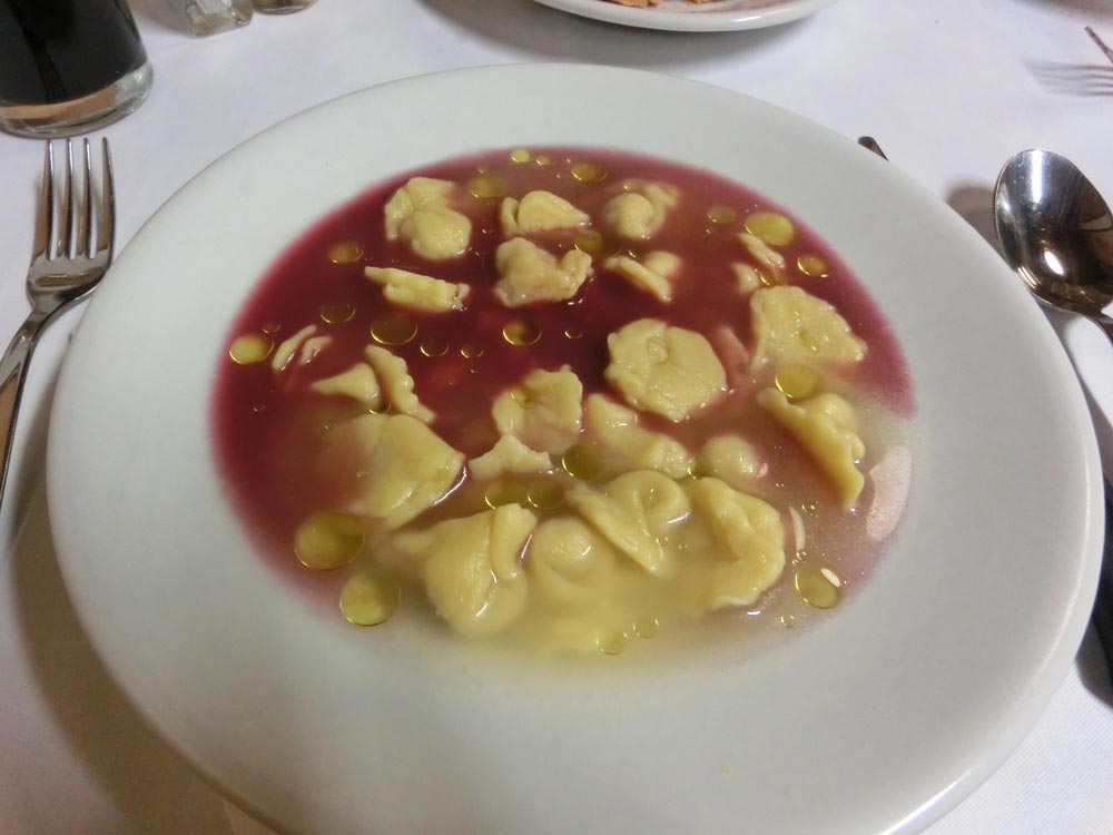 Cappelletti in brodo. This dish is traditionally eaten at Christmas, with a little bit of red wine and olive oil on top. 