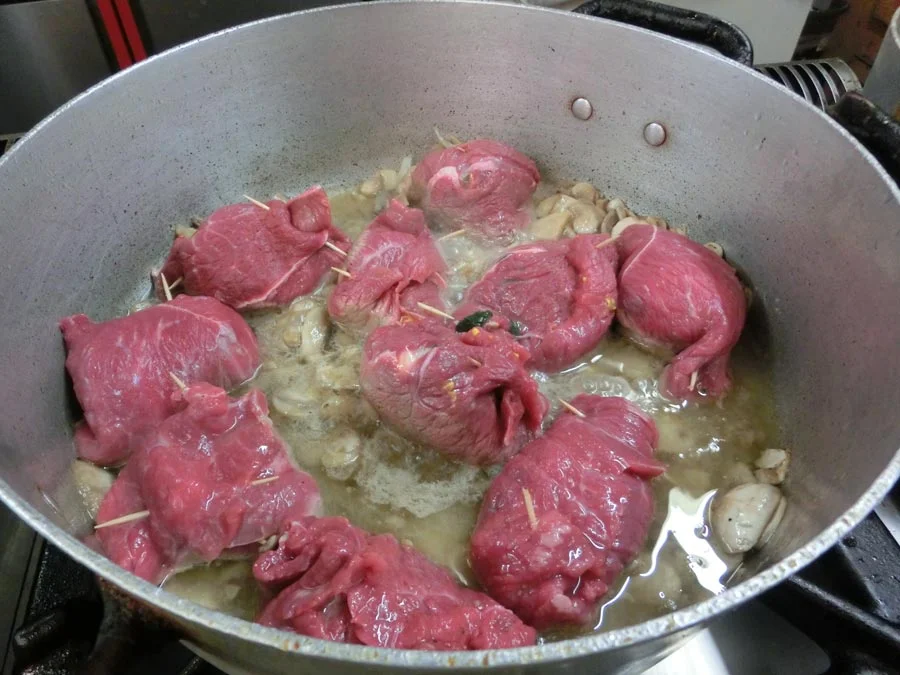 Involtini di manzo. Hidden inside these beef wraps are a half of a hard-boiled egg, a slice of scamorza cheese, and spinach. 