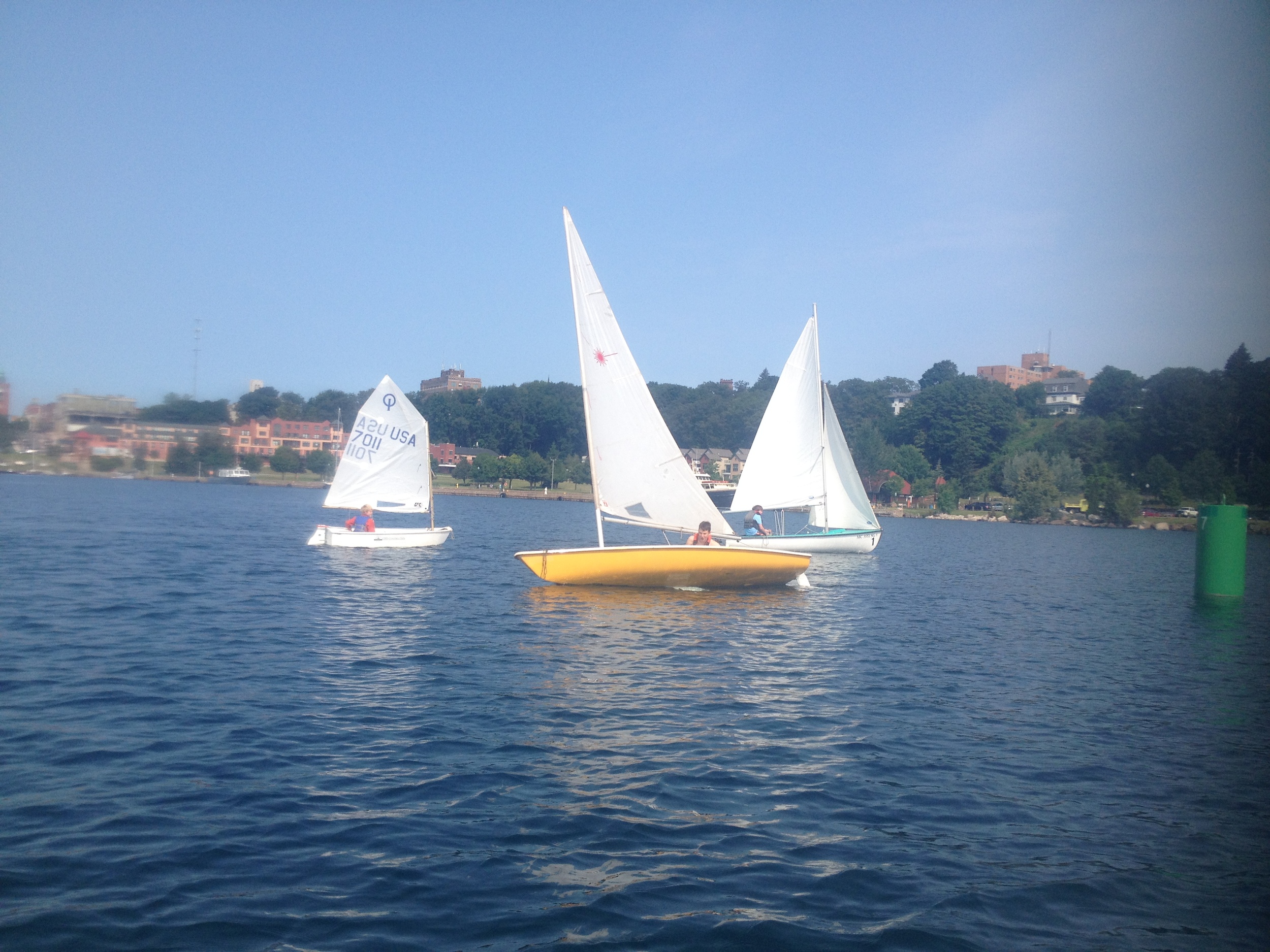 Boats in the harbor during sailing school. 