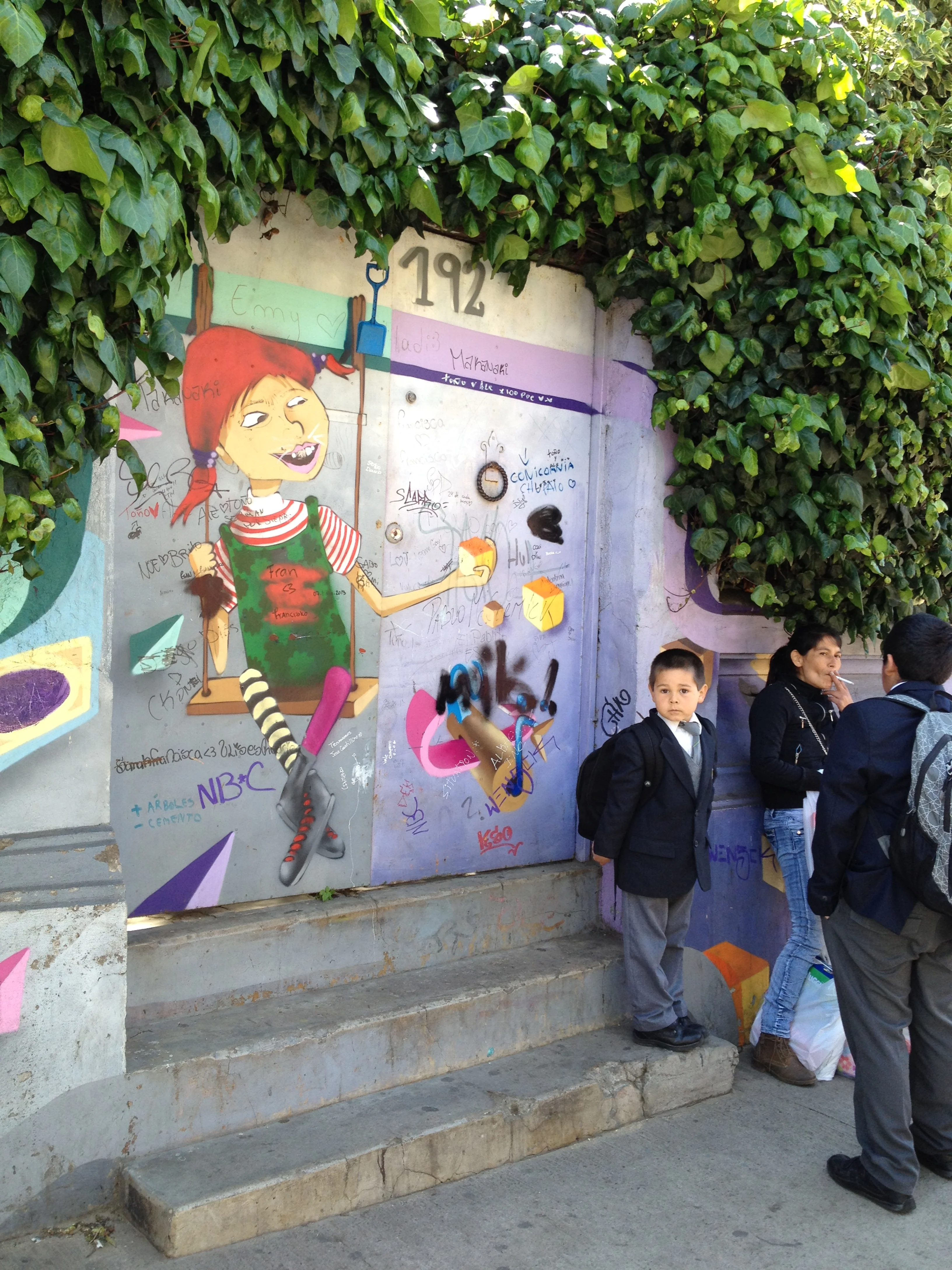 I feel like this street art is looking at that cute munchkin approvingly. Or maybe cheese? Can't tell.