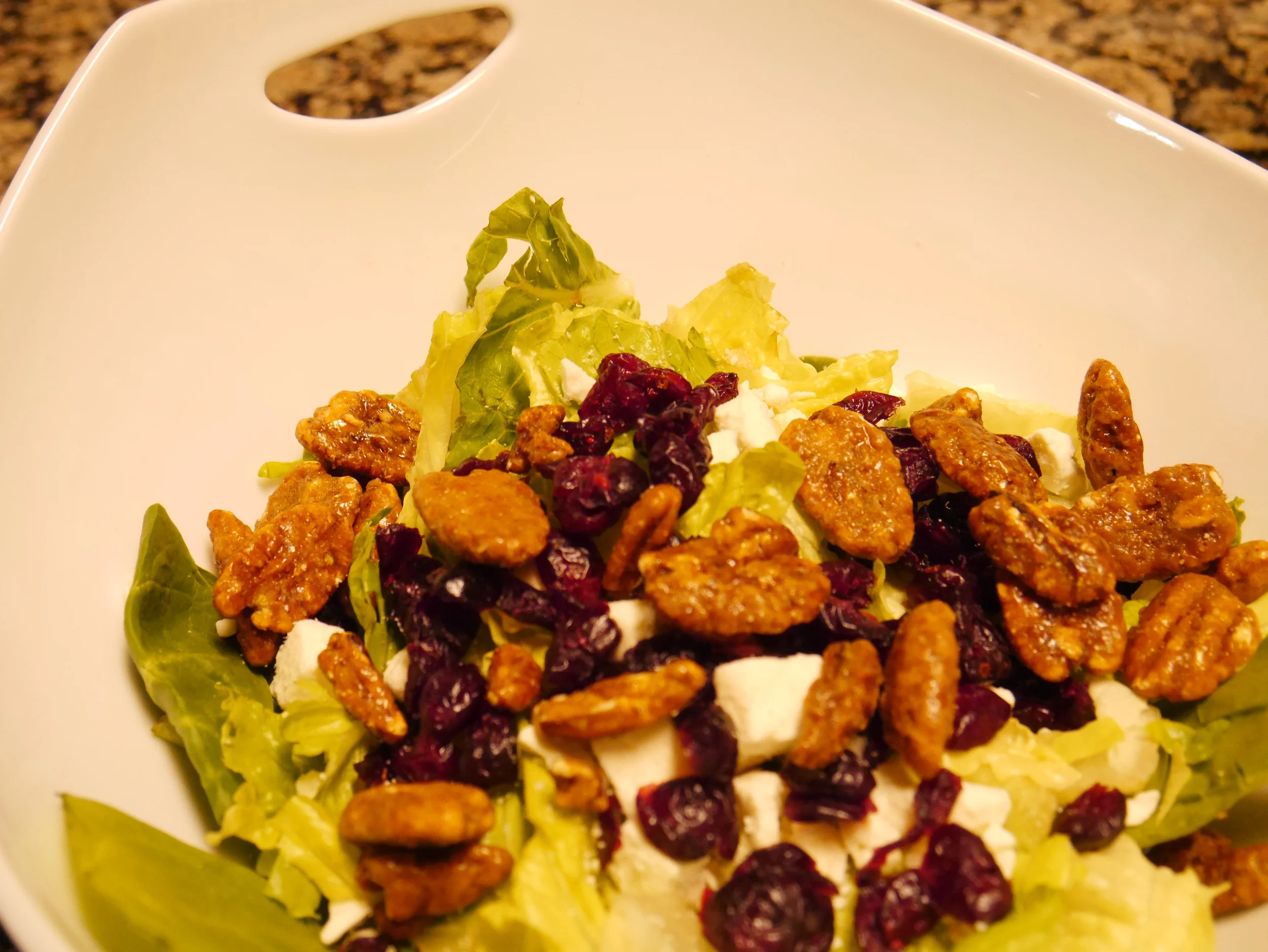 Spinach, romaine, feta, cranberry, and pecan salad. 