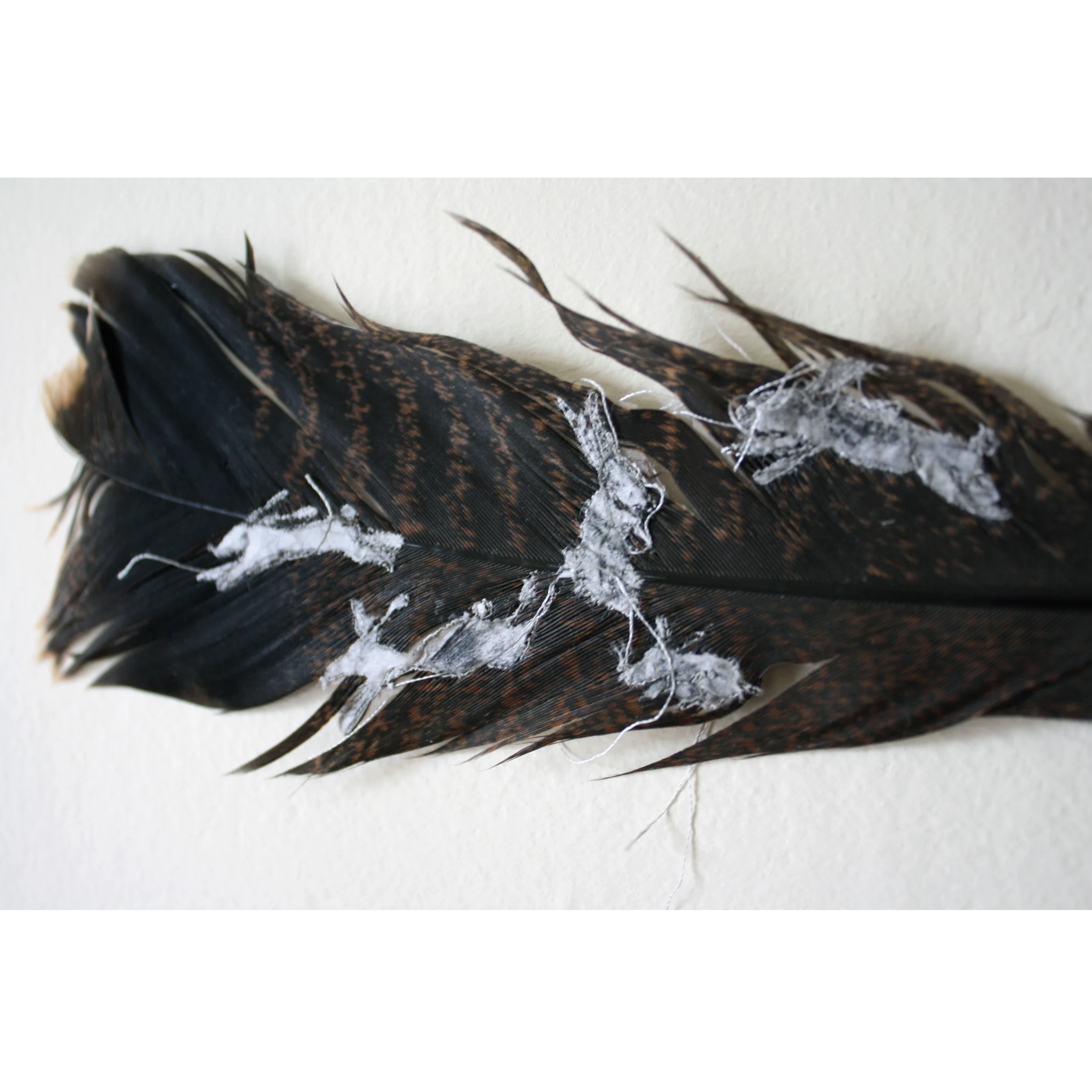 Free-motion embroidery and tissue on turkey feather 2010
