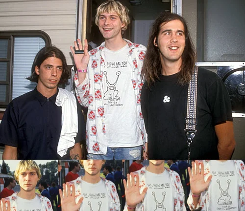 Kurt looking surprisingly chipper sporting the Daniel Johnston shirt. Mr. Grohl, it seems, isn't too pumped about it.