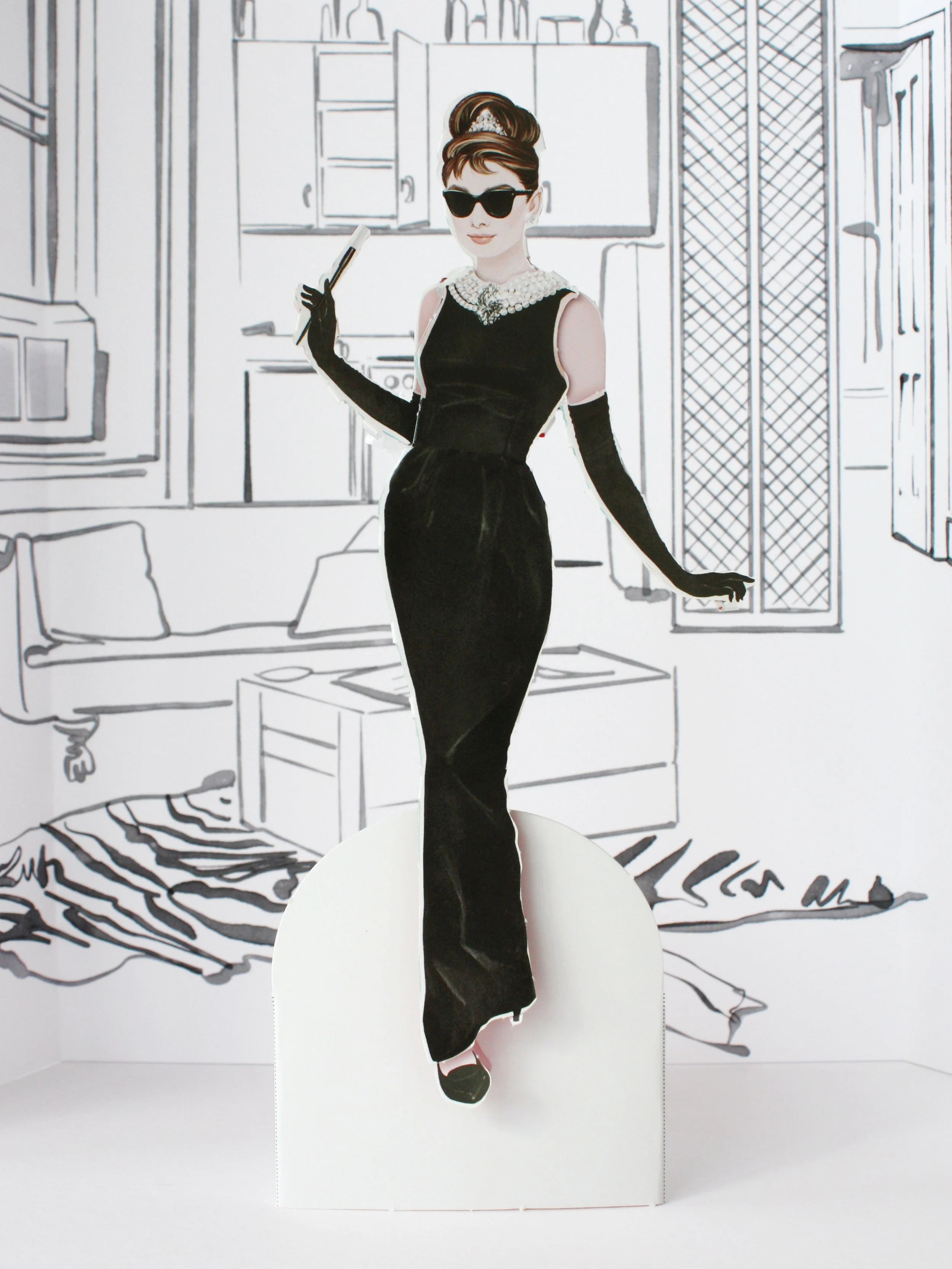 Assembled Audrey Hepburn paper doll. Dressed as Holly Golightly in 'Breakfast at Tiffany's.'