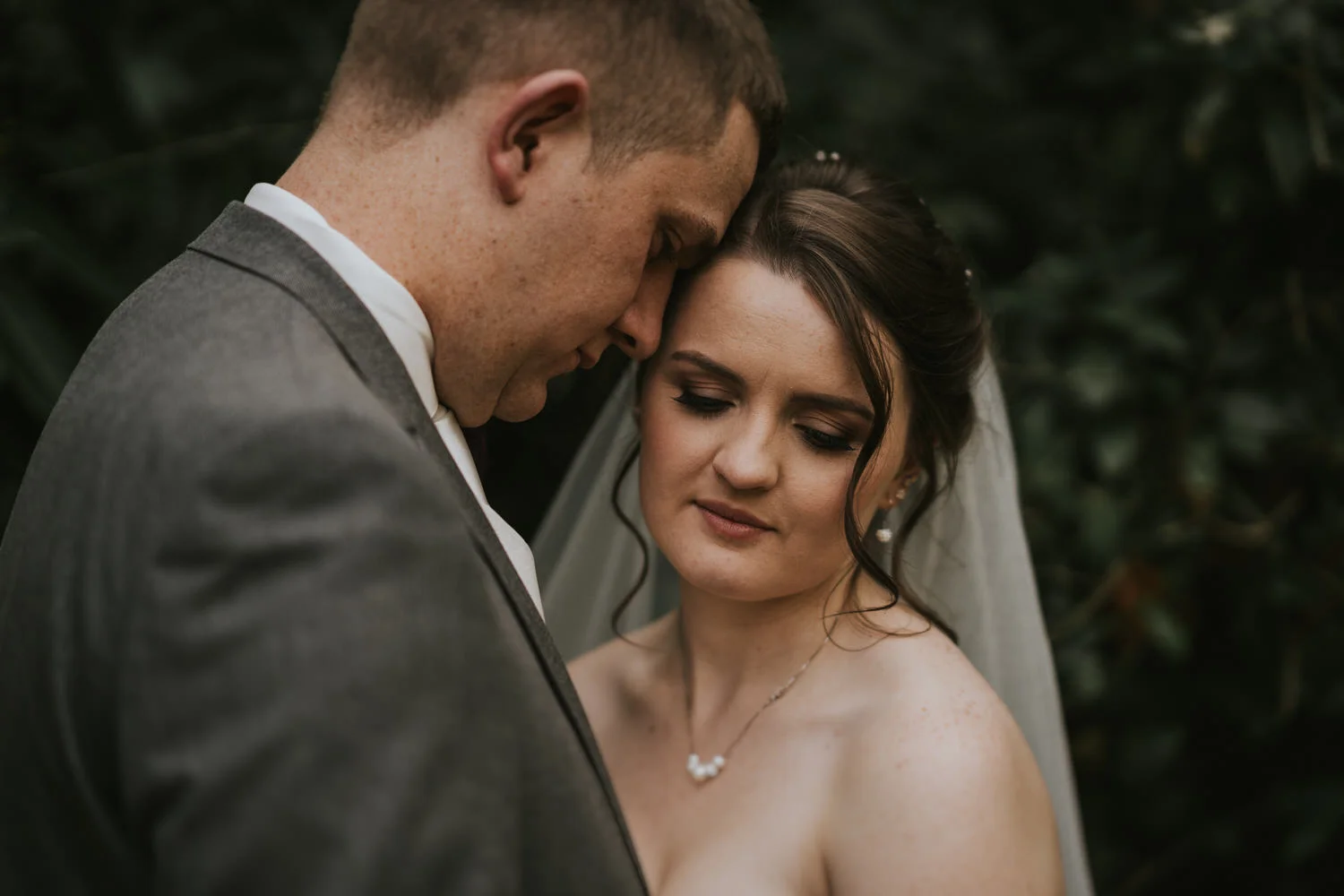 Close portrait of a groom and bride in her veil at The Rabbit Hotel, formerly the Templeton Hotel, Templepatrick
