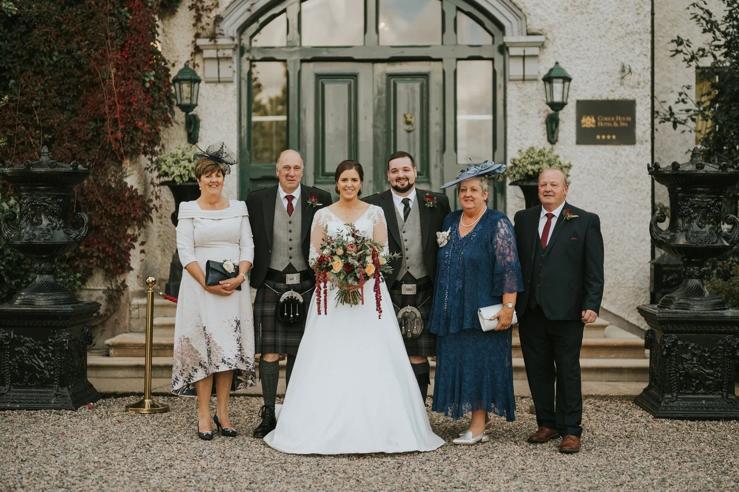 Family group photograph on the steps of Corick House Hotel and Spa