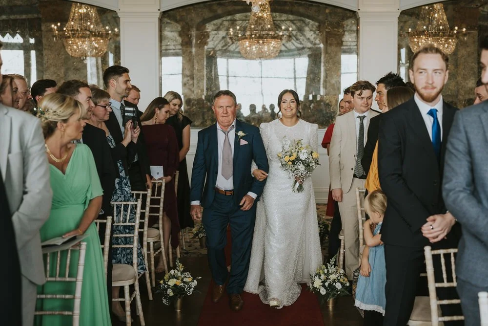 Bride walking down the aisle at a wedding at Slieve Donard Resort and Spa