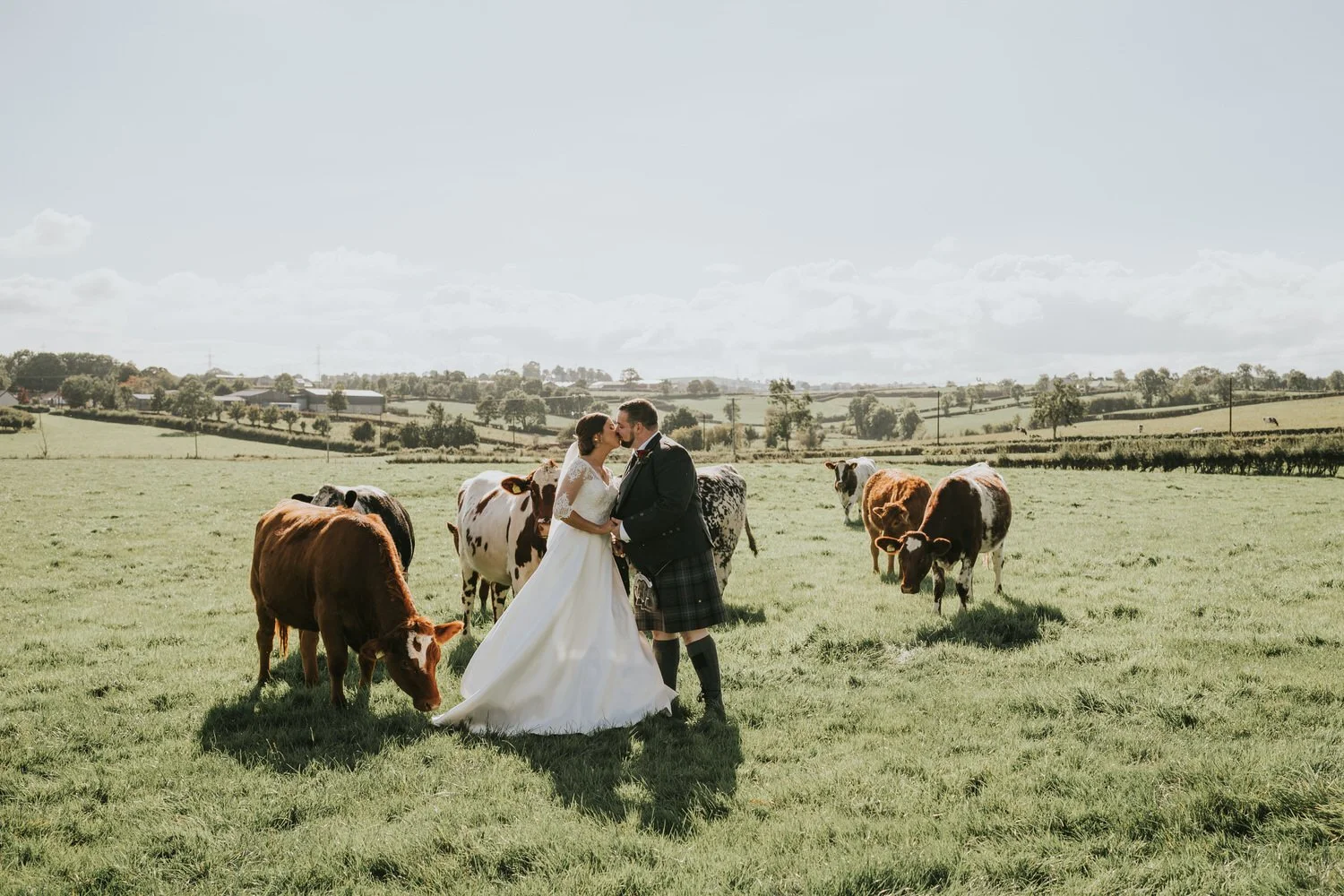 Ashleigh and Brooks' wedding at Corick House Hotel and Spa, with cows in the fields