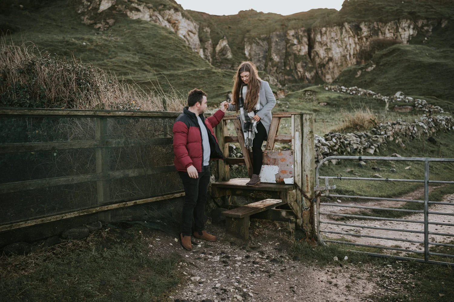 Couple enjoying the coastline together at Ballintoy Harbour