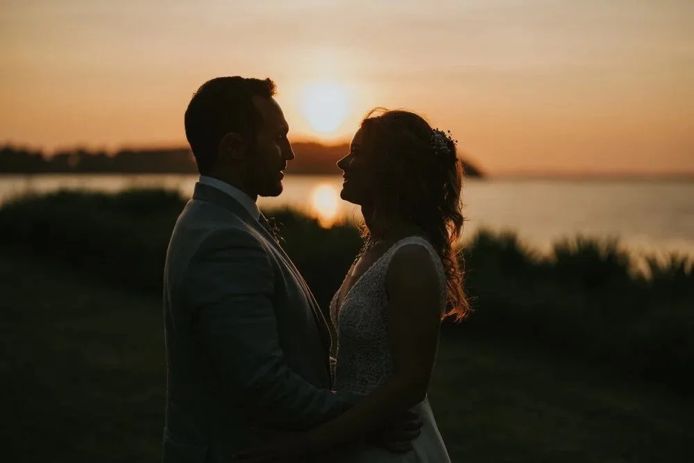 Sunset photo of bride and groom in Northern Ireland taken by Micro Wedding Photographer Pure Photo NI