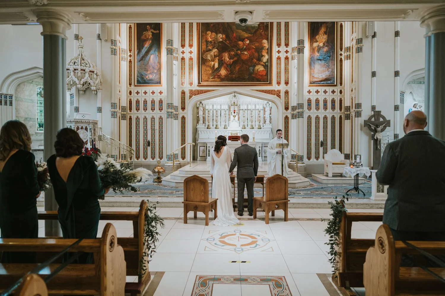 Bride and groom at the altar during their church ceremony in Belfast
