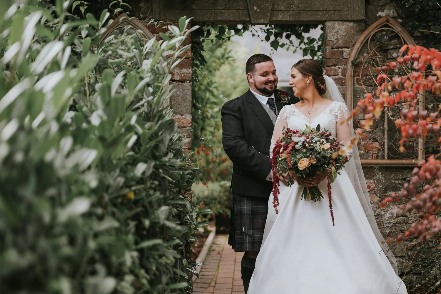 Bride and groom in the walled garden at Corick House Hotel and Spa