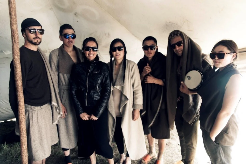 Tengri models pose for a picture backstage with Nancy, Tengri founder (3rd from left) before the show.