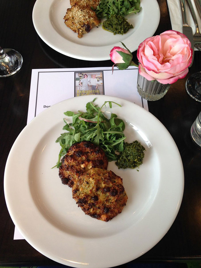 Quinoa, cauliflower, raisin and feta cakes (closest) and Low-carb fishcakes (background). Both recipes from The Ketogenic Kitchen