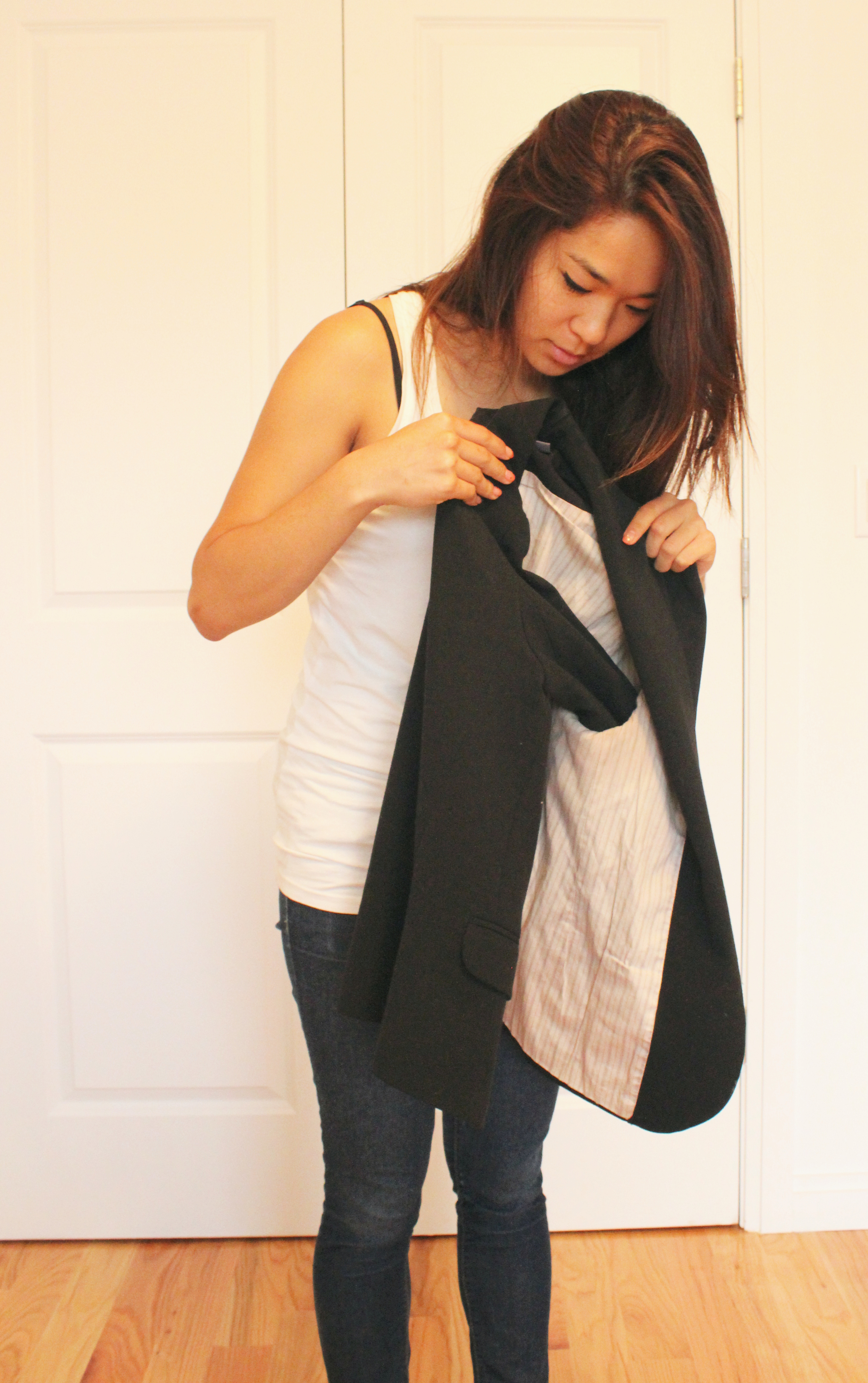 How to fold a blazer: put one of the sleeves into the other, it helps retain the shape