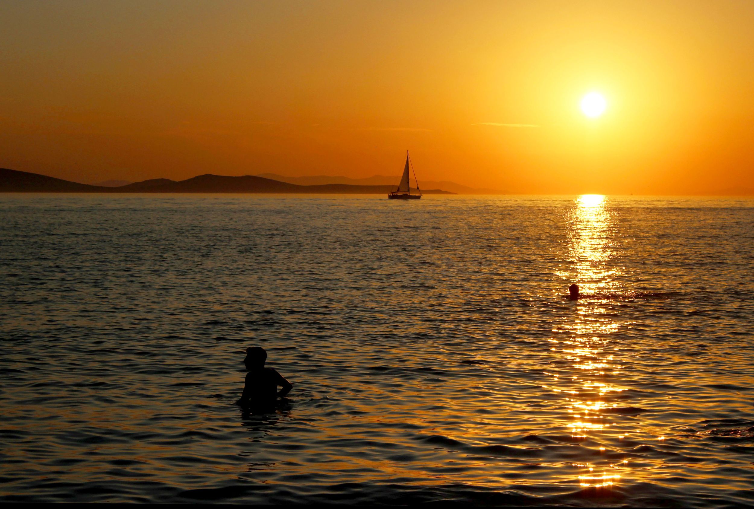 Mattia frolicking in the water to get a better view of the sunset