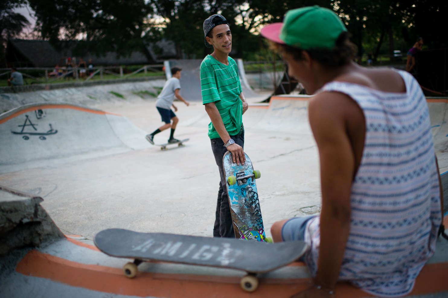 Orlando Enrique Rosales, 24, left, skateboards on a Sunday evening at a skate park in Havana. He has received equipment from Cuba Skate, a nonprofit organization in the United States. (Sarah L. Voisin/The Washington Post)