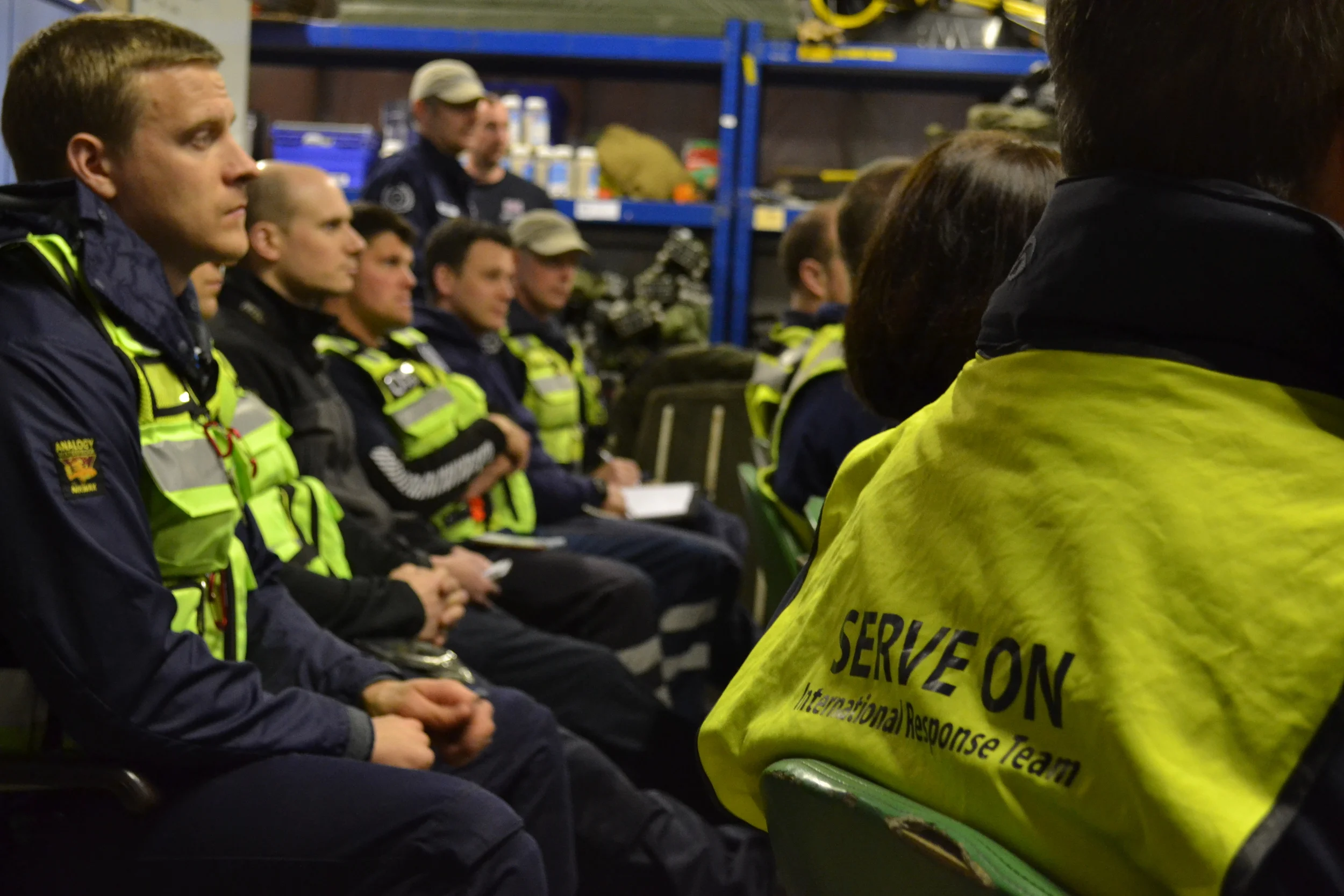 The team listening to the briefing and scenarios